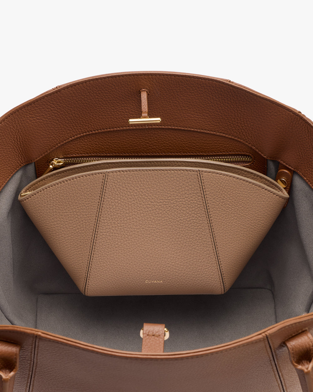 Open handbag showing a zippered pouch inside.
