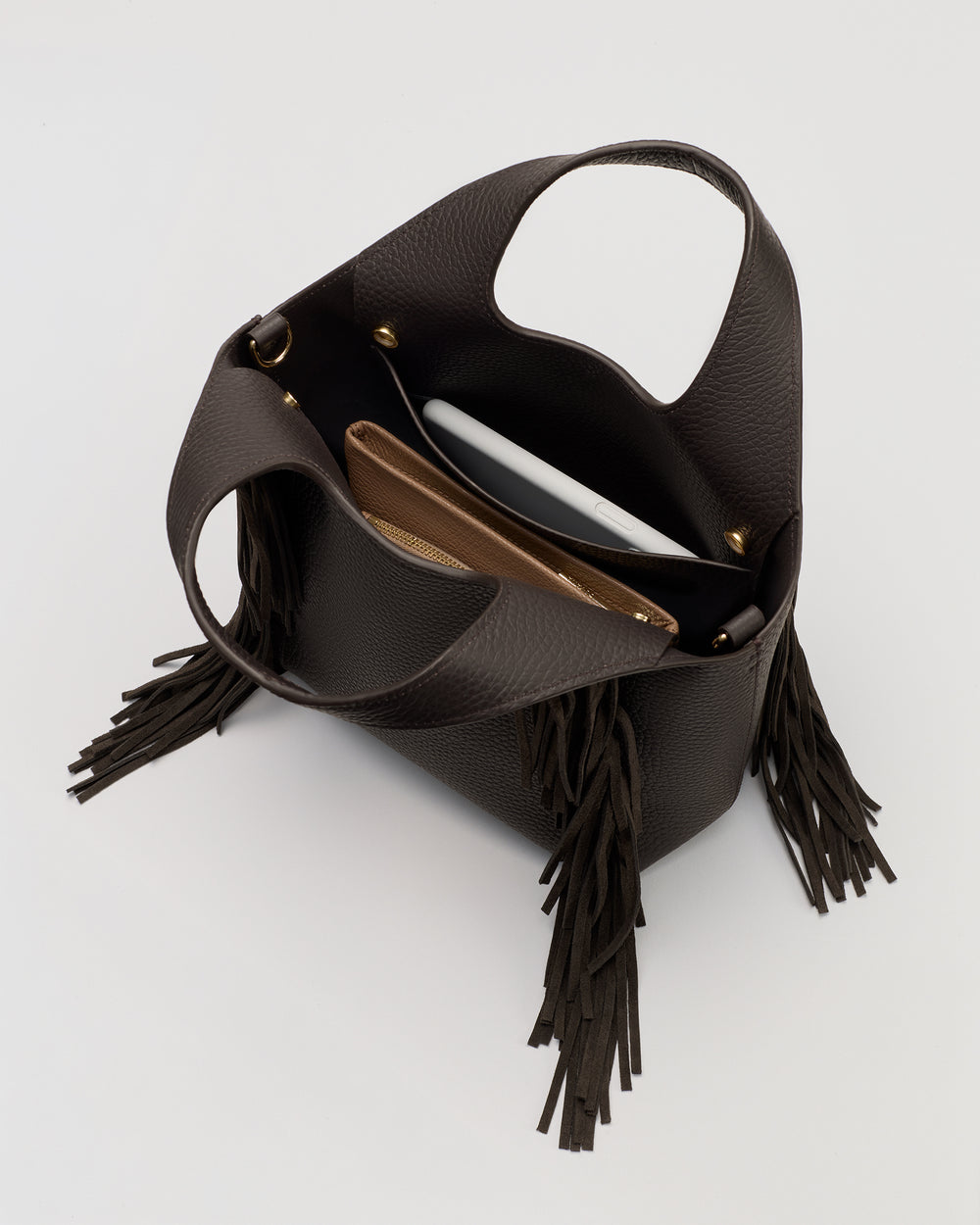 Open handbag with two purses and fringe detail on the side.