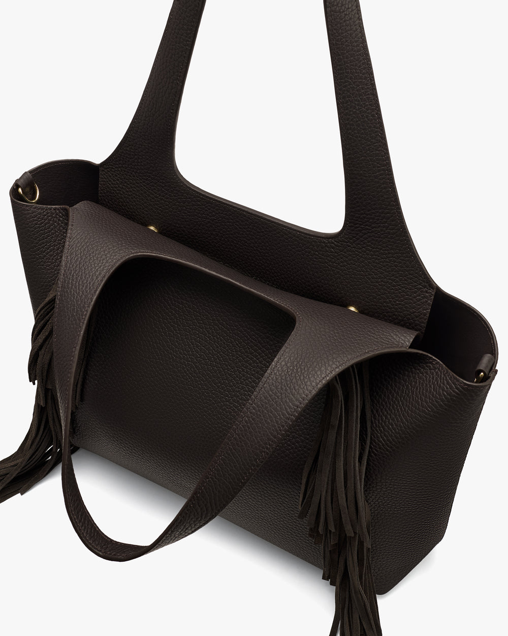 Tote bag with fringe details and two handles.