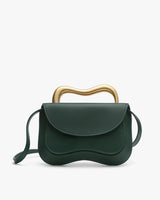 Handbag with a curved handle and flap closure.