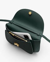Open shoulder bag with phone and zipper pouch inside.