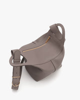 Bucket bag with a rounded shape and a top zipper closure