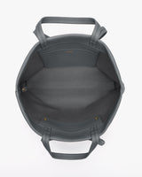 Open handbag with two handles shown from above.