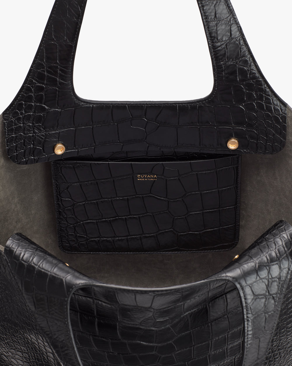 Tote bag interior with croc-embossed leather and a small pocket.