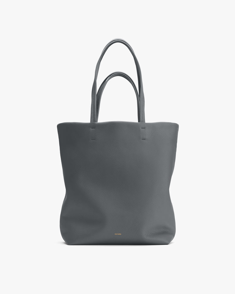 Tote bag with two handles on plain background.