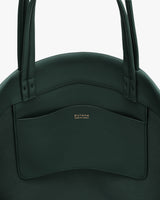 Close-up of a tote bag with pocket and handles.