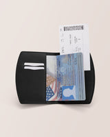 Open passport holder with a visible boarding pass and passport inside