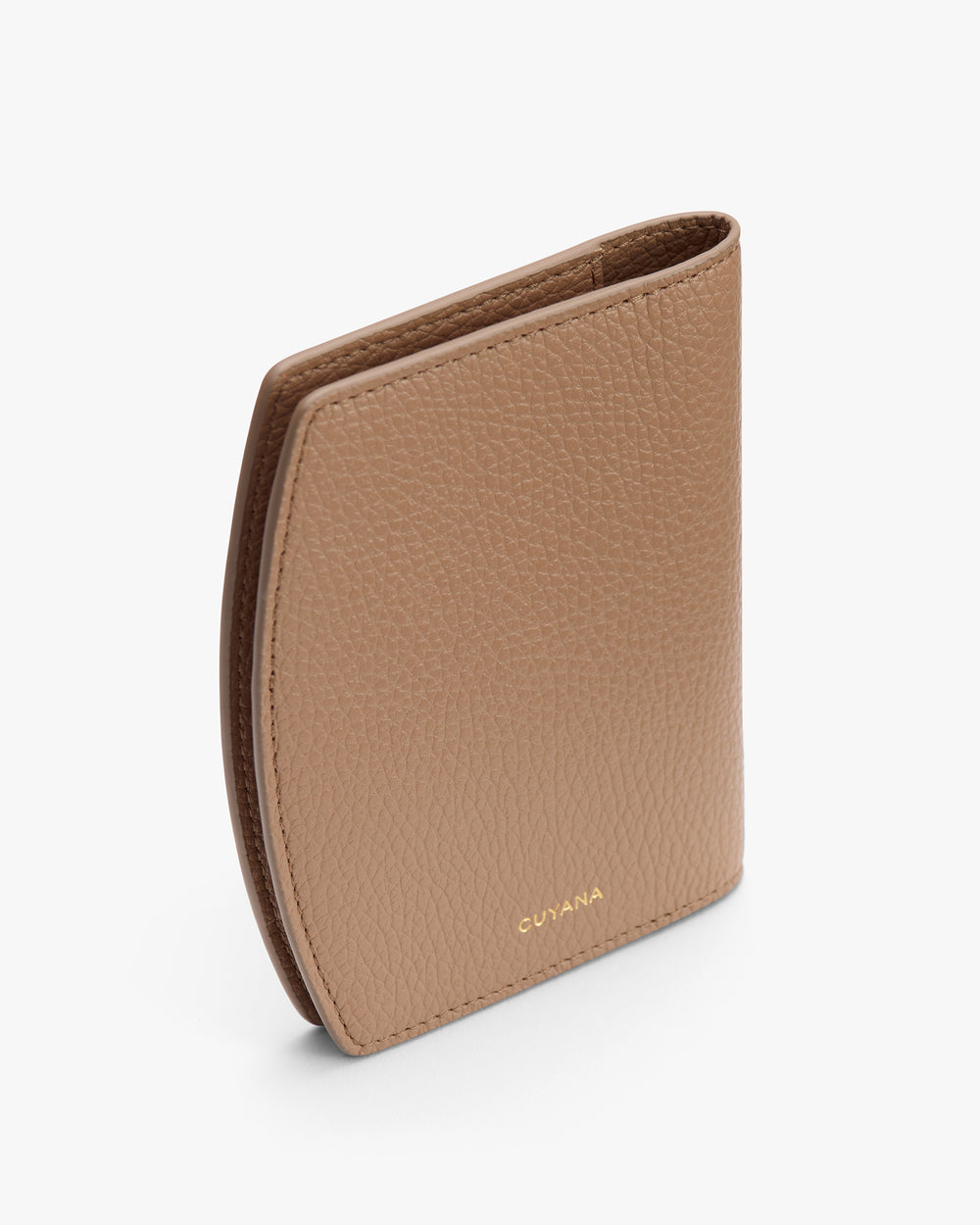 Compact folded passport cover against a plain backdrop