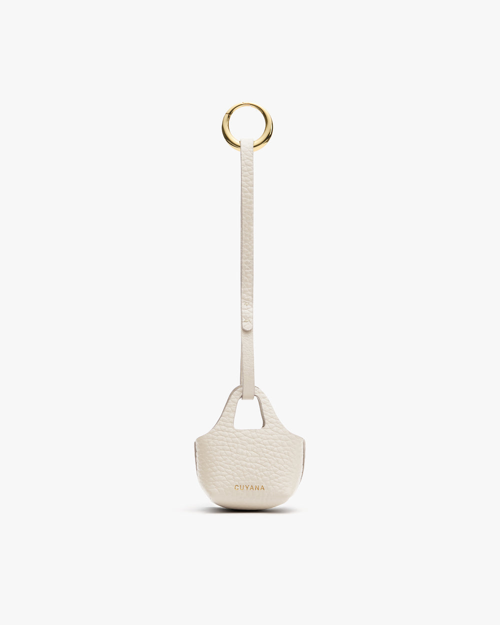 Small textured bag charm with a loop and round metal ring.