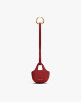 Keychain with small textured pouch and a loop handle.