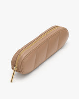 Zippered pouch with quilted design and gold zipper.