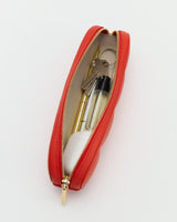 Zip pouch containing keys, a pen, a lighter, and a small bottle.