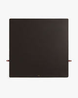 Square leather desk mat with small strap loops on two sides.