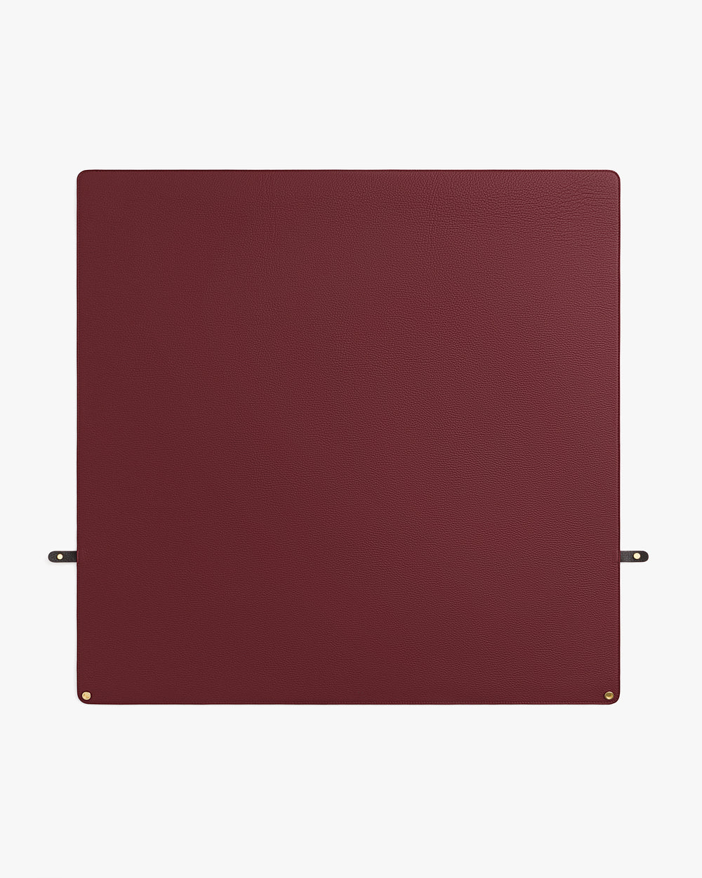 Square mat with small gold corner accents and two side straps.
