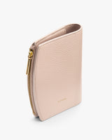 Small textured zippered wallet standing upright