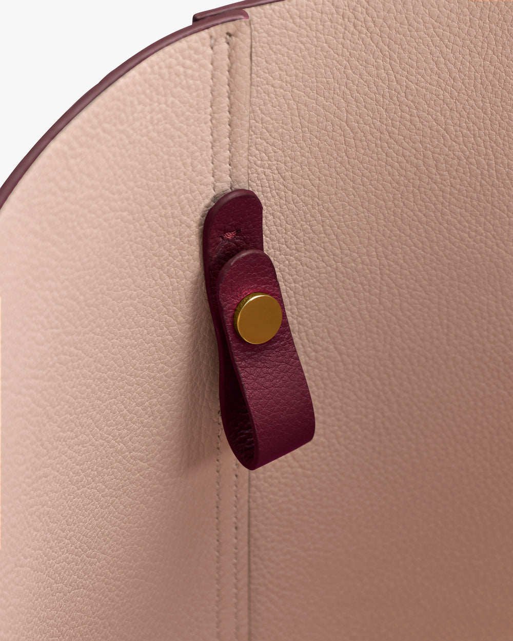 Inside view of a bag with a magnetic closure and textured surface.