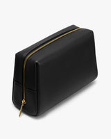 Rectangular toiletry bag with a zipper on top.