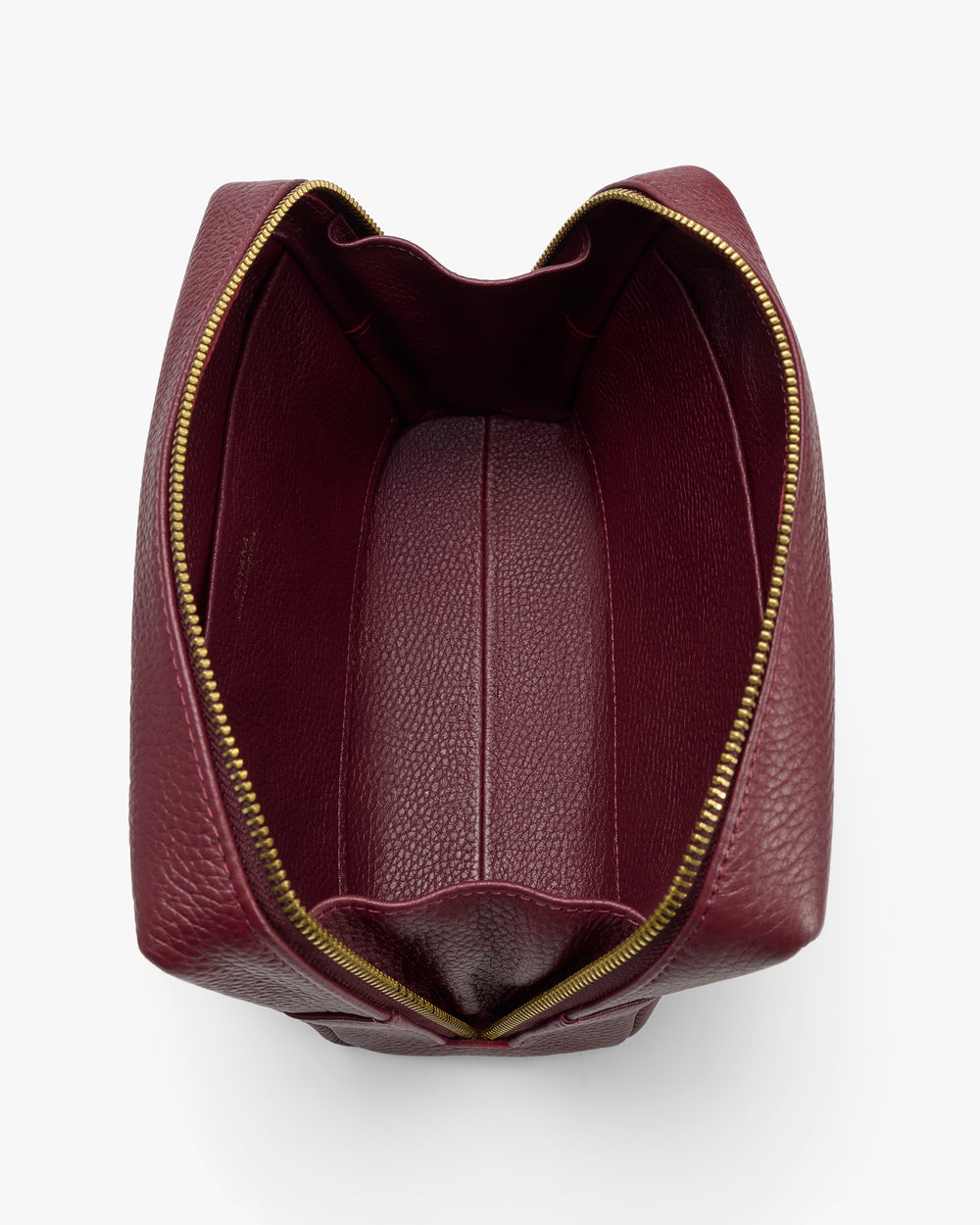 Open travel bag with zipper and textured leather interior.