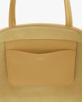 Close-up of a tote bag with interior pocket.