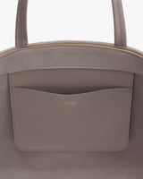 Tote bag with front pocket and handles.