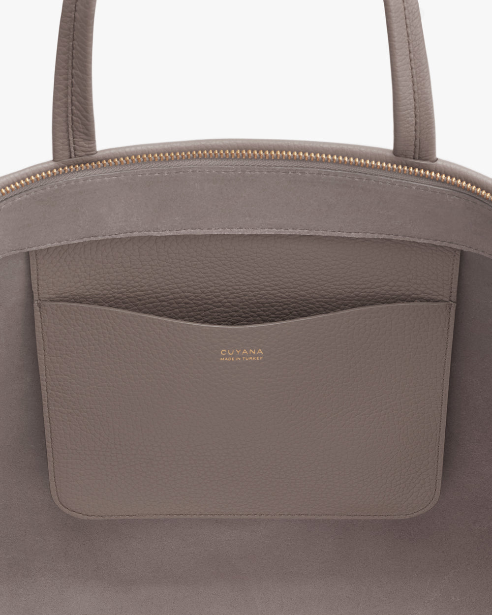Tote bag with top handles and pocket featuring logo.