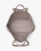 Open tote bag with visible handles and inner pocket.