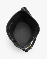 Open leather tote bag with a strap and interior pocket.