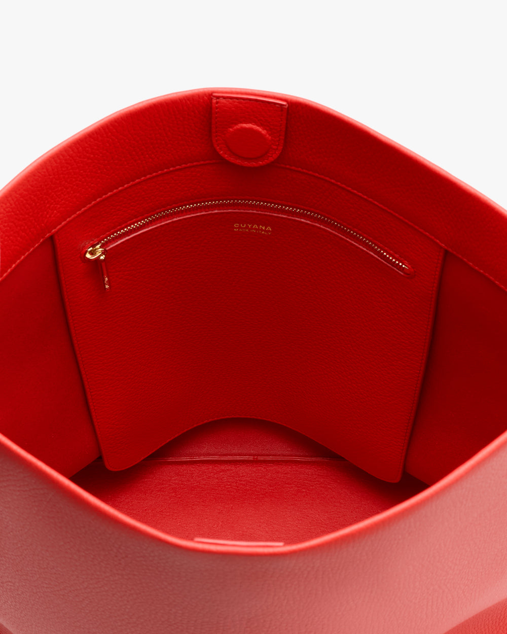 Interior view of a handbag with a zippered pocket.