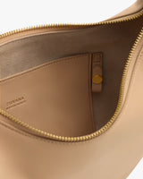 Open purse with interior pocket and zipper detail.