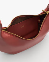Open handbag with visible interior pocket and zipper closure