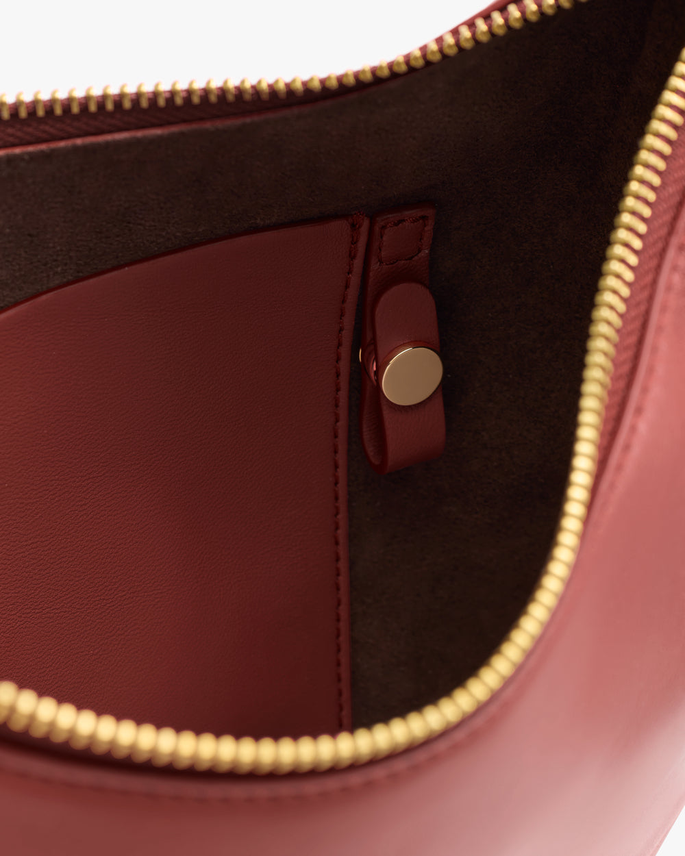 Open handbag with visible interior pocket and zipper.