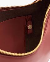 Open handbag with visible interior pocket and zipper.