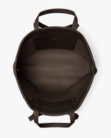 Open travel bag with visible interior pockets and handles.