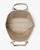 Open top view of a spacious tote bag with interior pockets and handles.