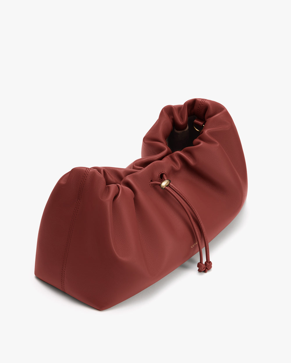 Soft, gathered travel bag with drawstring closure.