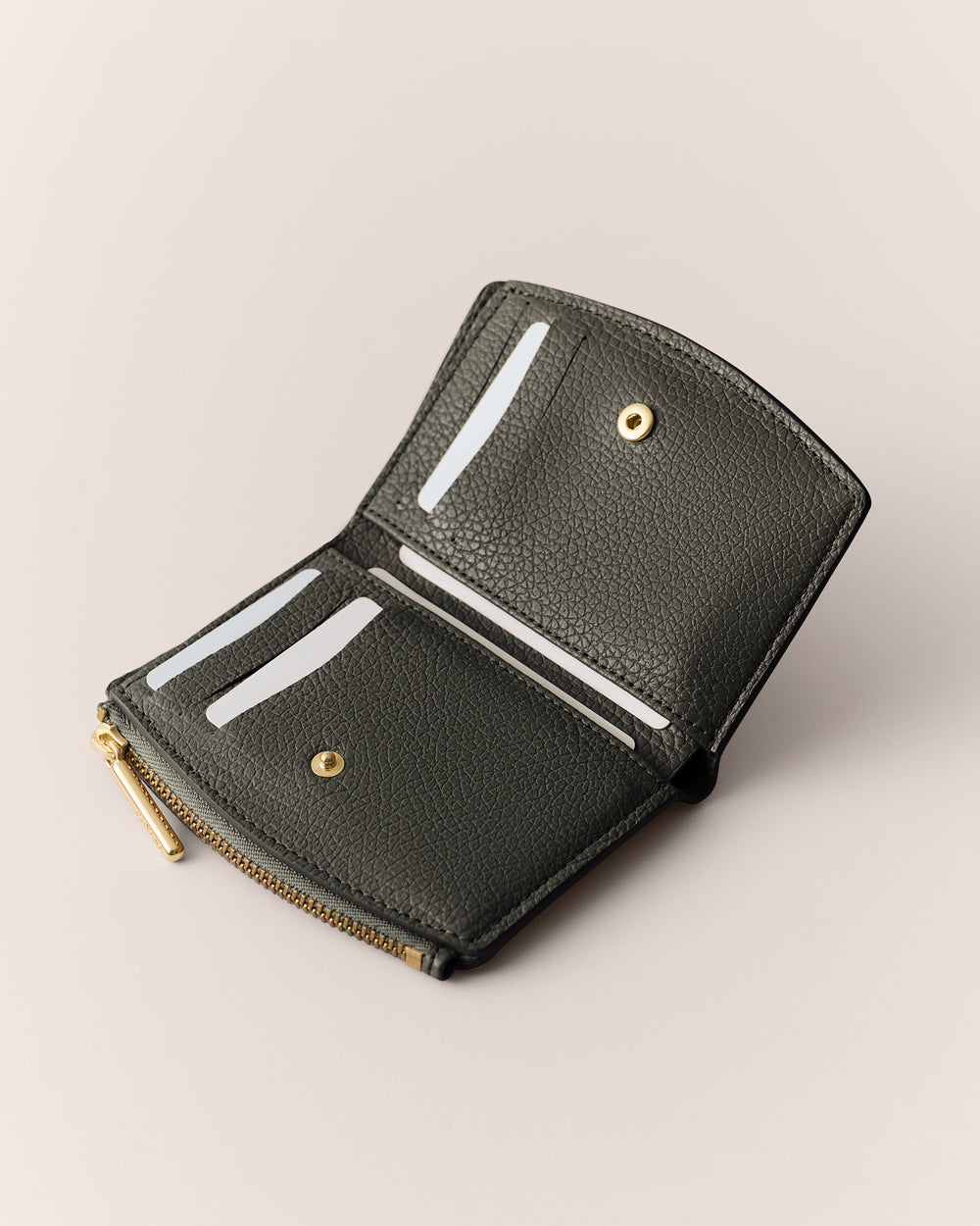 Open wallet with card slots and zipper compartment.