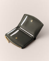 Open wallet with card slots and zipper compartment.