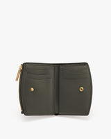Open wallet with card slots and snap buttons.