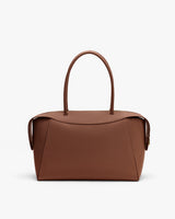 Handbag with two handles and a structured design.