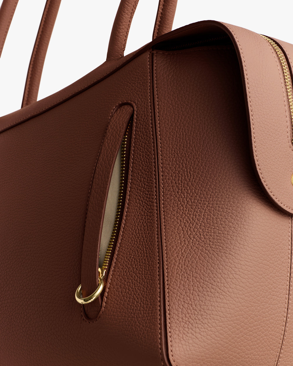 Handbag with a zipper and handles.