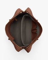 Open top view of a travel bag with multiple compartments.