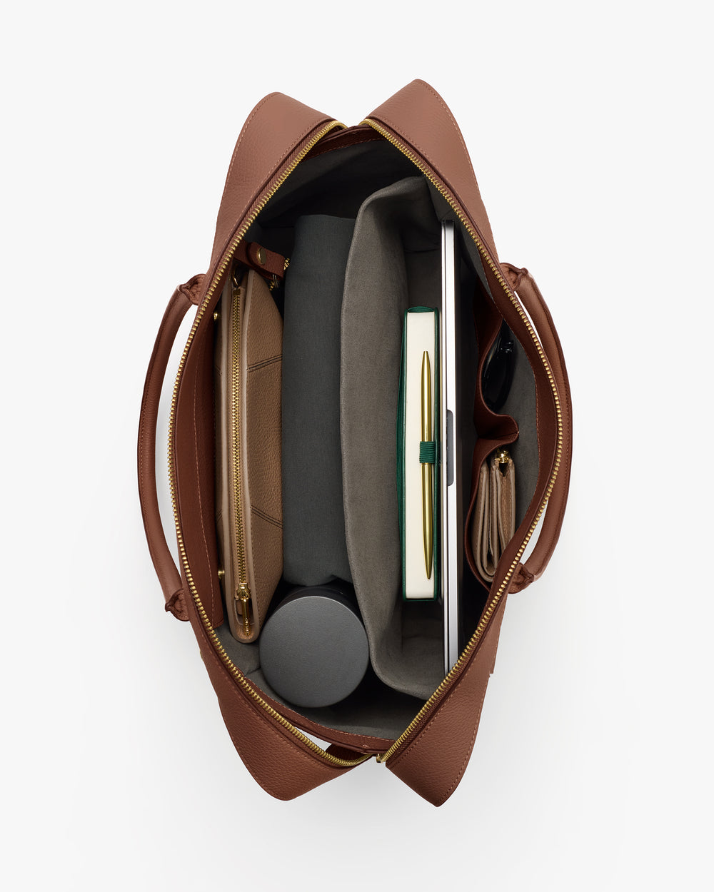 Top view of an open travel bag with various items inside.