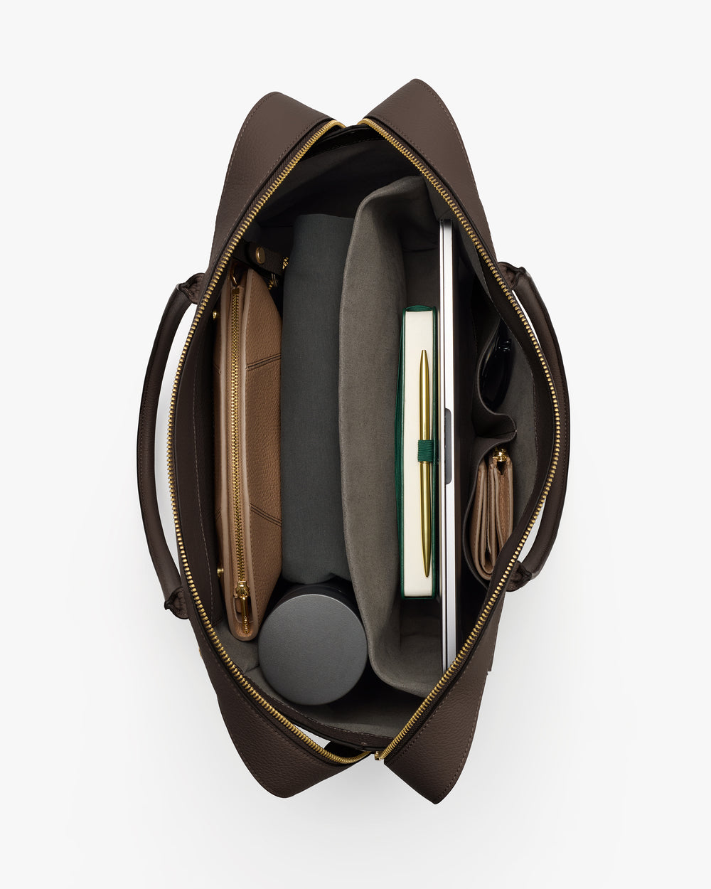 Open travel bag with organized compartments and various items inside.