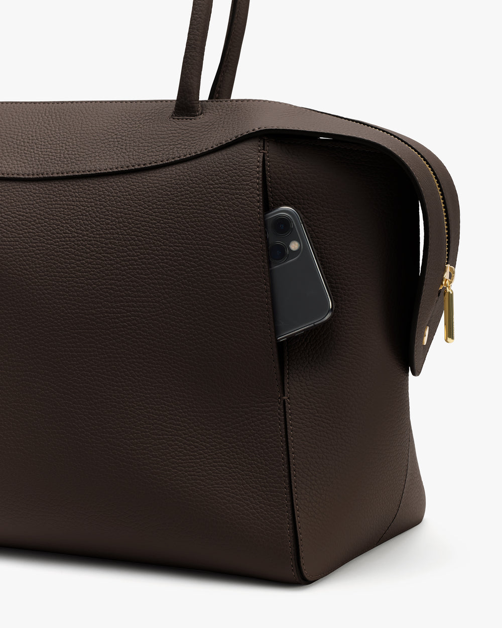Travel bag with phone in side pocket and a zipper on the side.