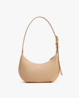 Shoulder bag with a curved shape and a short handle.