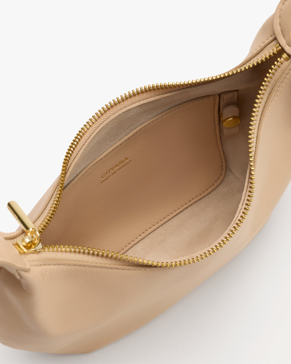 Open belt bag with zipper and small interior pocket.