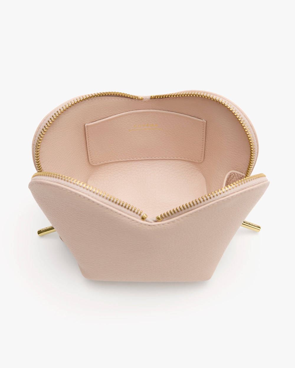 Open handbag with zipper and interior pocket.