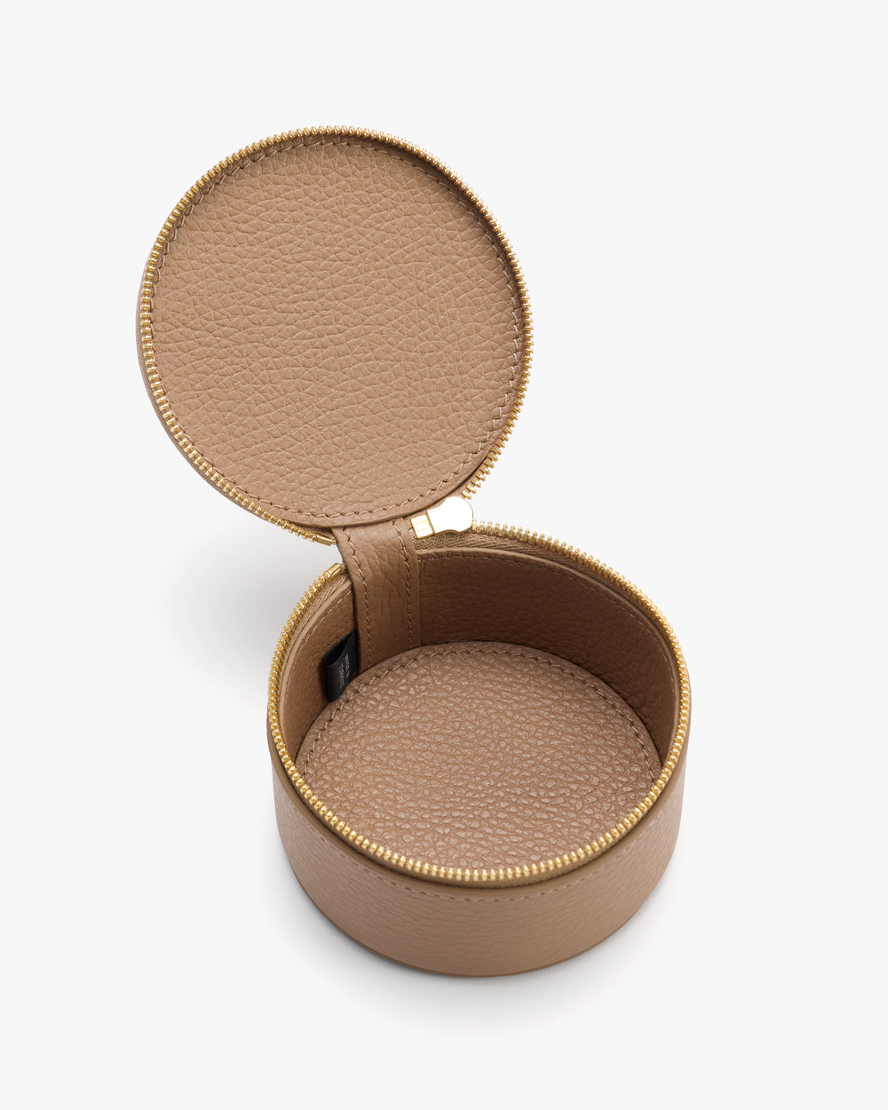 Round jewelry case with zipper, open lid, and textured surface.