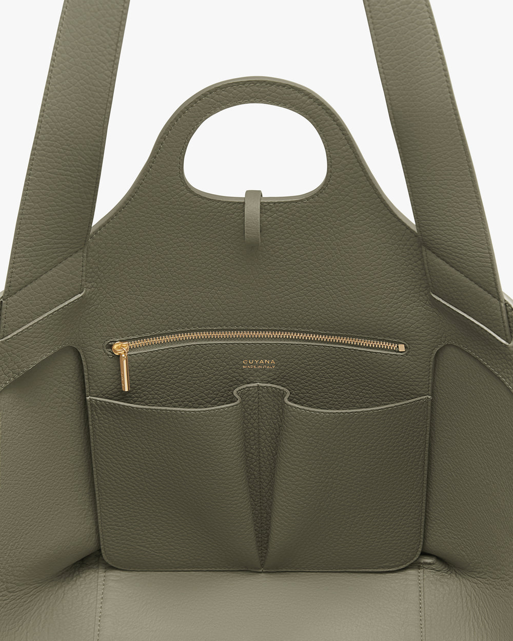 Open handbag with pockets and zipper visible inside.