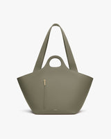 Fashionable tote bag with a small front zipper pocket and two straps.